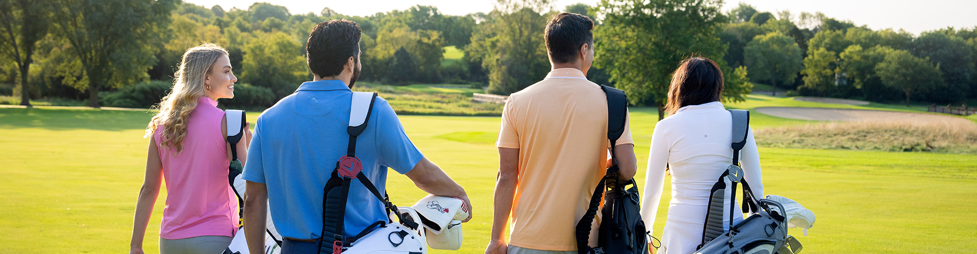 Group Walking With Golf Bags