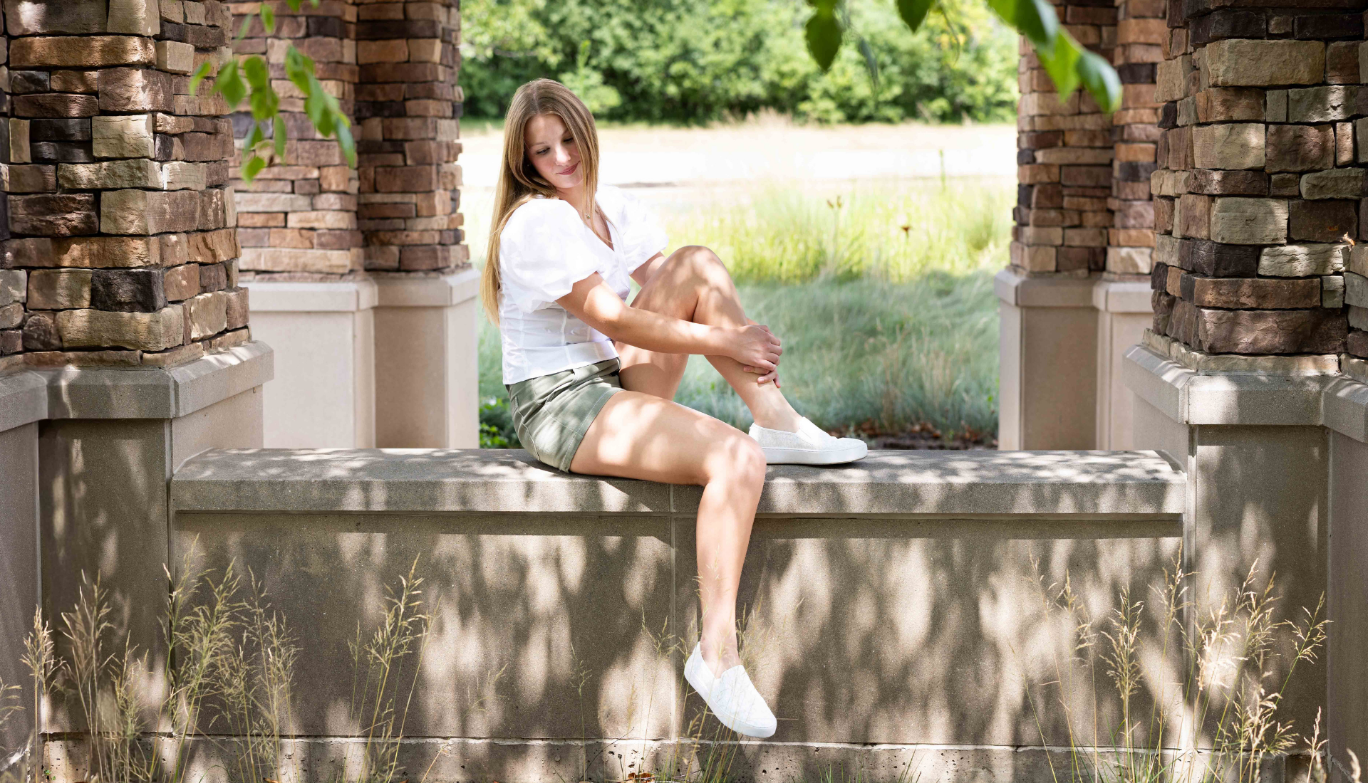 Person sitting on ledge 