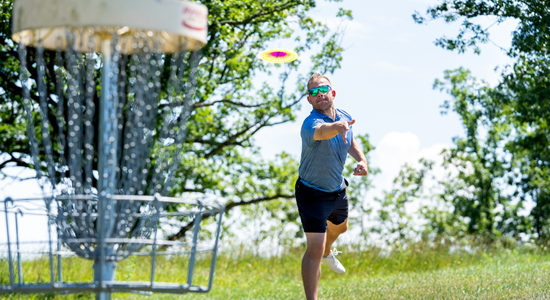 Man playing disc golf