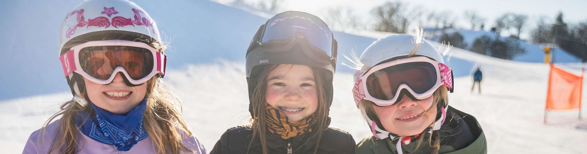 Three girls skiing at The Mountain Top