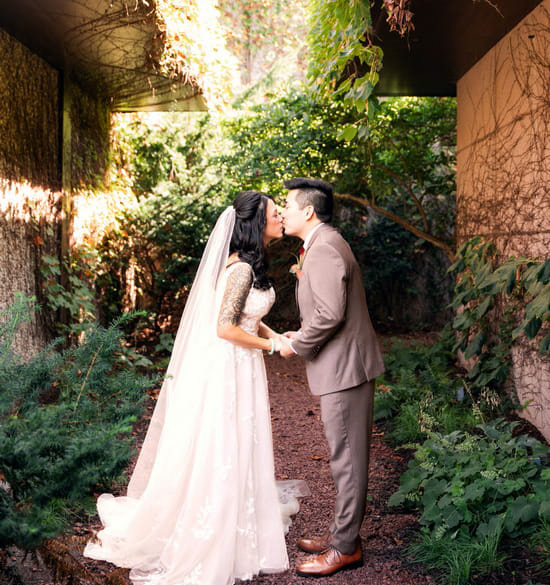 Couple kissing on their wedding day