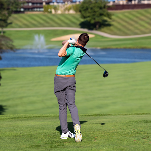 Man teeing off on The Brute Golf Course