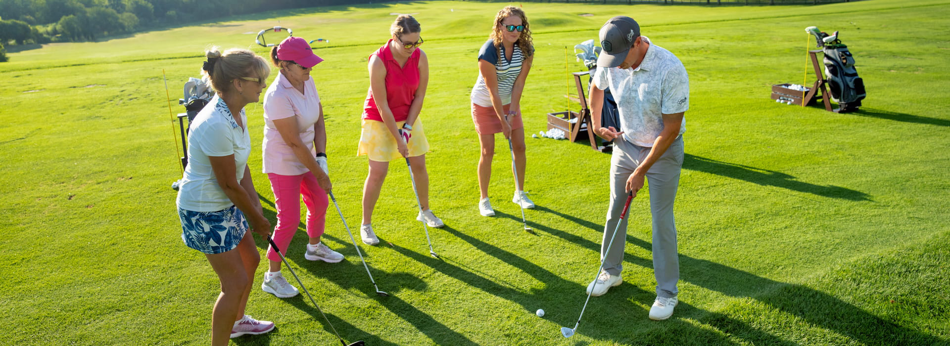 Ladies at a golf lesson