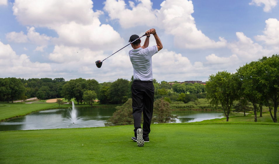 Man Teeing Off on The Brute Golf Course