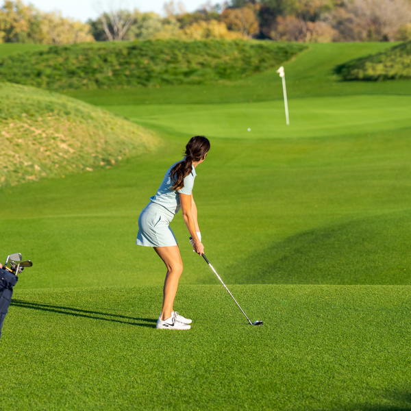 Woman hitting a ball on Wee Nip