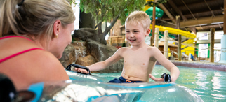 Mom and son floating in the lazy river