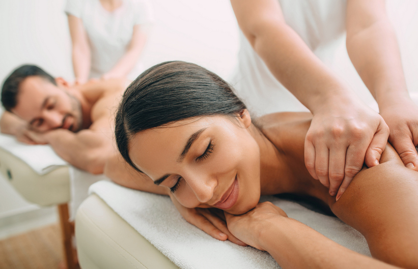 mv_A man and woman enjoying a couples massage