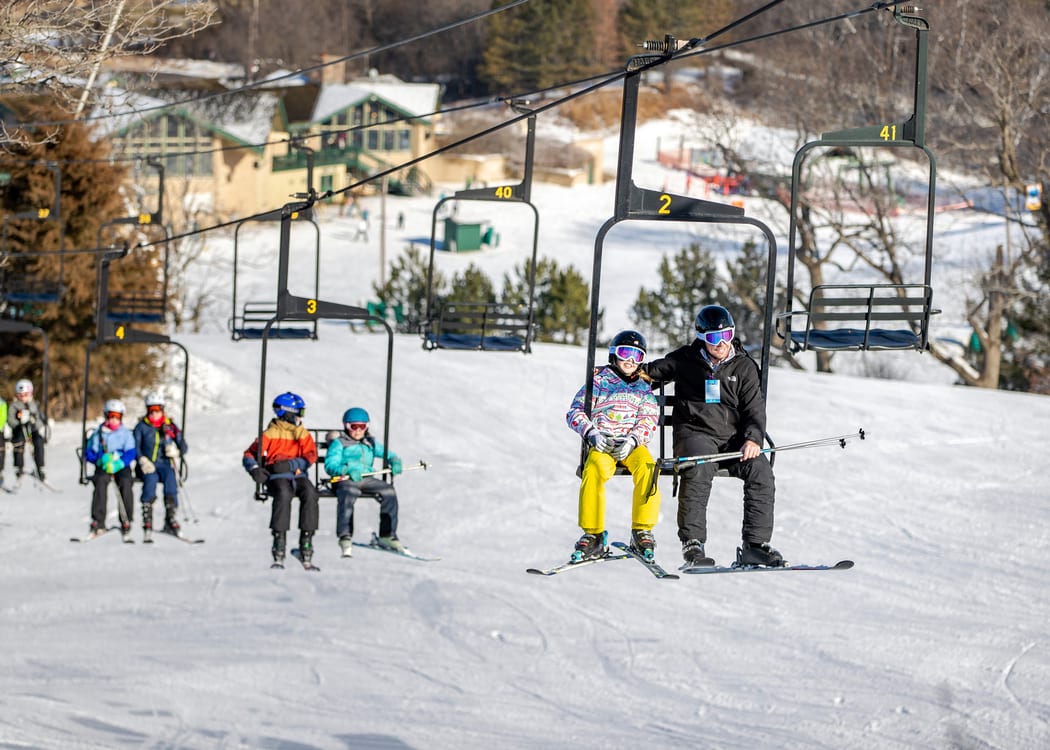 Dad and daughter on chairlift
